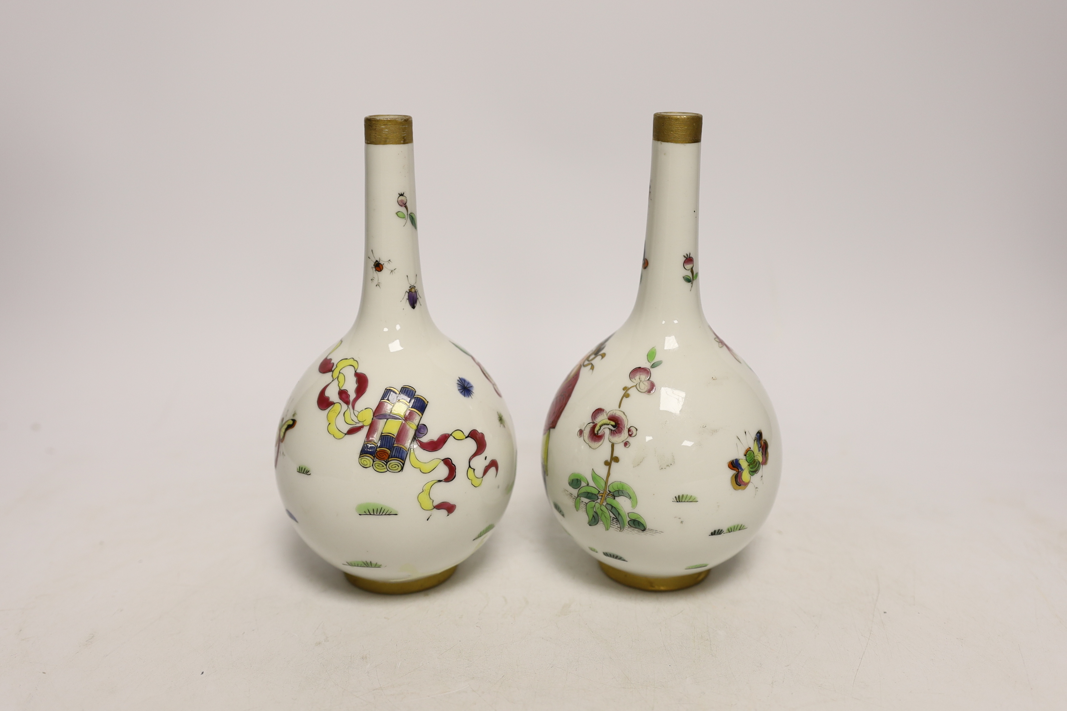 A pair of Continental porcelain bottle neck vases, 17cm high